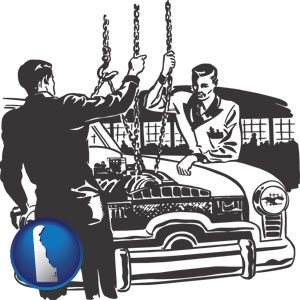 auto mechanics hoisting an engine out of a car with chains - with Delaware icon