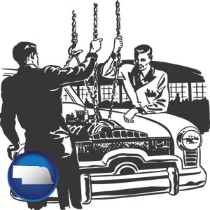 auto mechanics hoisting an engine out of a car with chains - with Nebraska icon